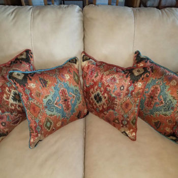 Southwestern Accent Pillows to add a personality to suede couch. Fabric supplied, and custom pillows made by Fabrics That Go.